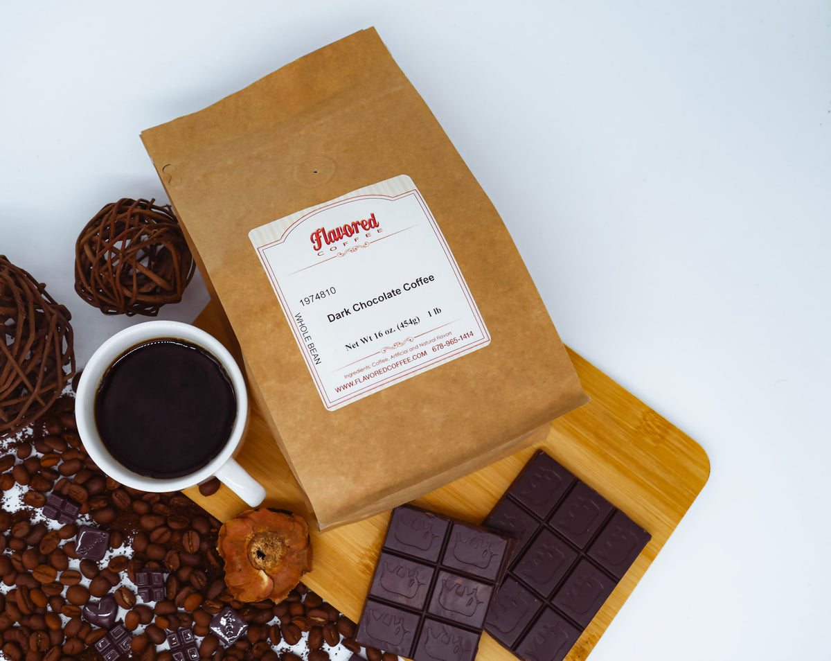 Kraft paper coffee bag with a label, cup of coffee, chocolate bars, and coffee beans on a white background