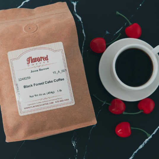 Flavored Coffee package with a cup of coffee and cherries on a dark surface