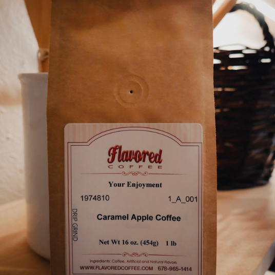Coffee bag with 'Flavored Coffee' label on a wooden surface