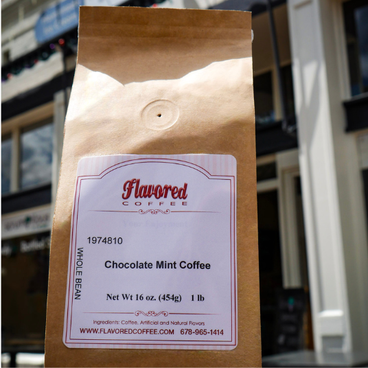 Kraft paper coffee bag with a label on a blurred city street background