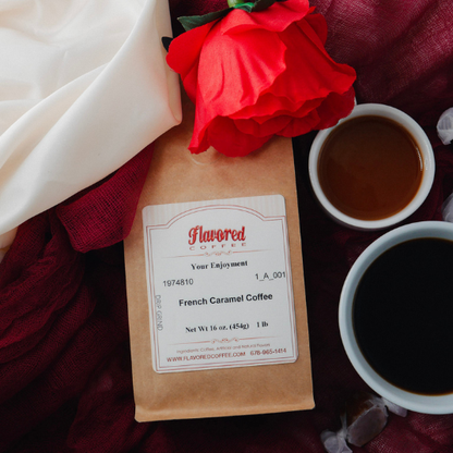Flavored Coffee package with a red flower and two cups of coffee on a dark surface