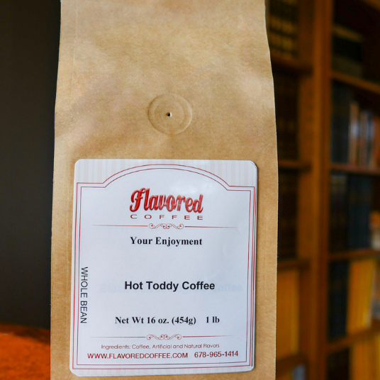 Coffee bag with a label on a blurred bookshelf background