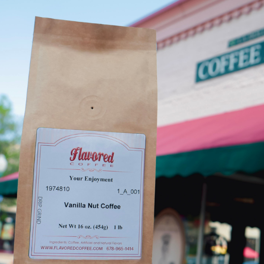 Bag of vanilla nut coffee with a blurred coffee shop in the background