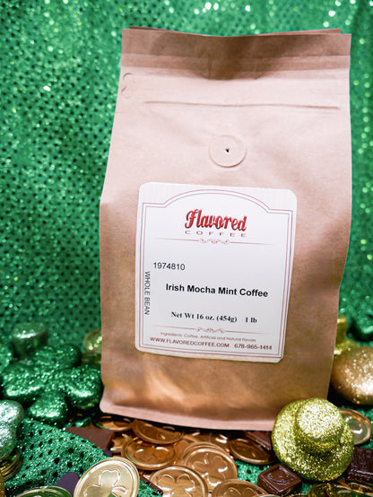 Coffee bag labeled 'Irish Mocha Mint Coffee' on a festive background with gold coins and green decorations.