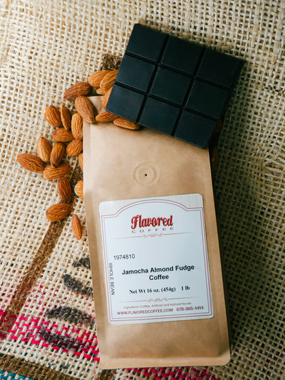 Flavored Coffee package with a block of chocolate and almonds on a textured fabric background